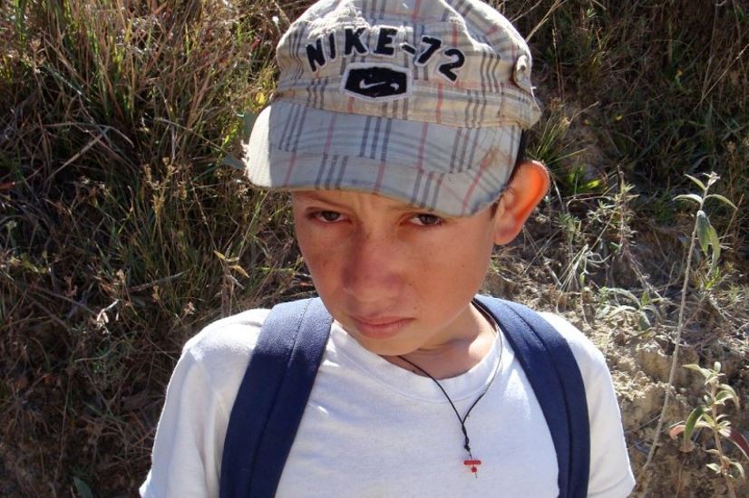 Henry closer to when Dr. Ball first met him. He is now a 21-year-old helping his parents on their small farm despite his heart condition.