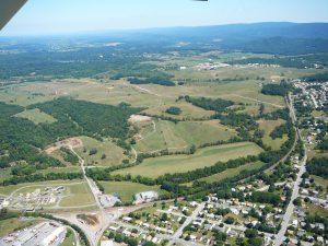 That doesn’t look like the Avtex-Royal Phoenix site – because it’s not, it’s the former Millennium Lotus property purchased by ITFederal CEO Curt Tran. The 70+ acre site is slated to house an agricultural training center and cattle ranch and personal residence. The parcel runs just west (below in photo) of the FRLP property and Mary’s Shady Lane, the long dirt road across the upper-center section of photo.
